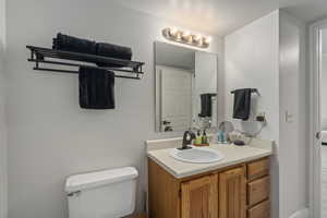 Bathroom featuring vanity and toilet