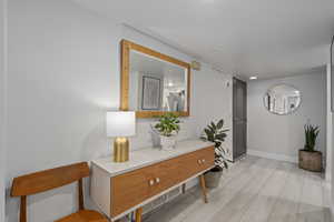 Hallway featuring light wood-type flooring