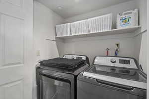 Laundry area featuring separate washer and dryer