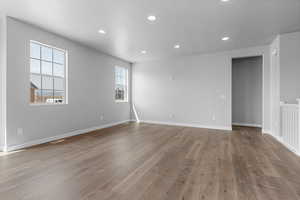 Empty room featuring a textured ceiling and light wood-type flooring