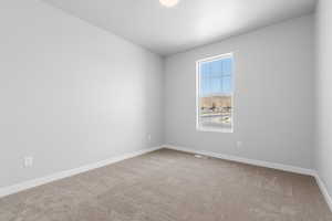 View of carpeted spare room