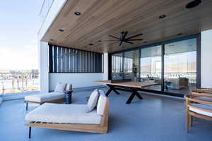 View of patio / terrace with ceiling fan and a balcony