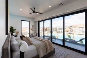 Bedroom with access to exterior, ceiling fan, and carpet