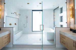 Bathroom with vanity and independent shower and bath