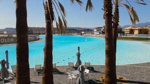 View of swimming pool with a mountain view