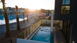 View of pool at dusk