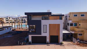 View of front facade featuring a mountain view and a garage