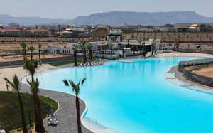 View of swimming pool with a mountain view