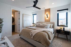 Bedroom with multiple windows and ceiling fan