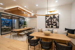 Dining area with light wood-type flooring and breakfast area