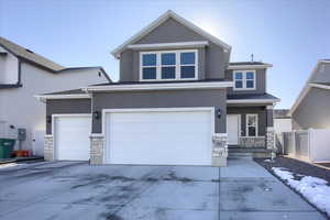 View of property with a garage