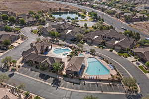 Aerial overview of property's location featuring a pool and a nearby body of water