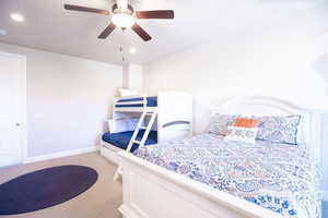 Bedroom featuring ceiling fan and twin over double bunk beds.