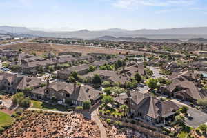 Aerial perspective of suburban area featuring a mountain backdrop