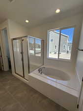 Full bathroom featuring a garden tub, a shower stall, tile patterned flooring, and recessed lighting