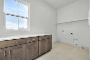 Laundry area with washer hookup and hookup for an electric dryer