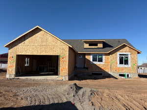 Property under construction with a garage