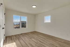 Unfurnished room featuring light hardwood / wood-style flooring