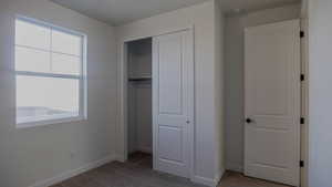 Unfurnished bedroom with carpet floors and a closet