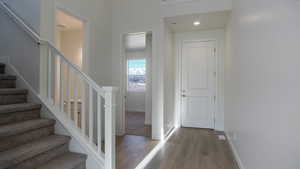 Foyer entrance featuring light hardwood / wood-style floors