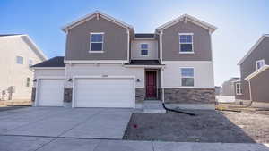 View of front of property featuring a garage