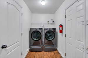 Laundry room with hardwood / wood-style flooring.  Washer and Dryer are EXCLUDED.