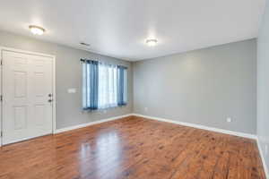 Entrance foyer with wood-type flooring