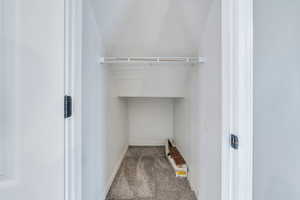 View of coat closet with lots of storage