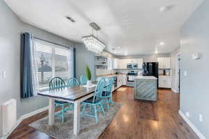 Dining area featuring dark hardwood / wood-style flooring