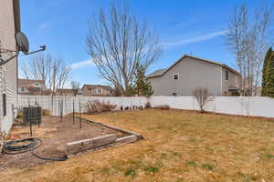 View of yard showing full vinyl fencing