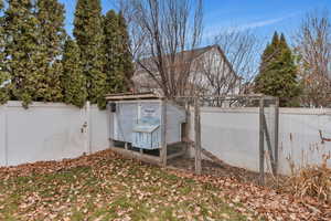 View of property exterior with the chicken coop that is included.  Get some chickens, save money on eggs