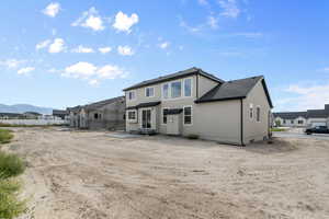 Rear view of property featuring a mountain view