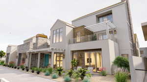 Rear view of property with a pergola