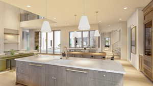 Kitchen featuring decorative light fixtures, sink, a large island, light stone counters, and light hardwood / wood-style flooring