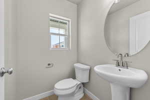 Bathroom featuring sink and toilet