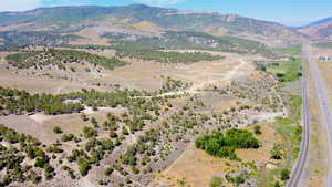 Aerial view of property's location featuring mountains and rural landscape