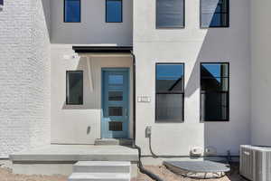 Entrance to property featuring central AC