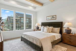 Carpeted bedroom with beamed ceiling