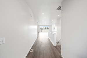 Corridor featuring dark hardwood / wood-style flooring