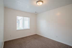 Empty room featuring carpet