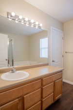 Bathroom featuring vanity and hardwood / wood-style floors