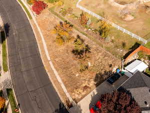 Birds eye view of property with a rural view