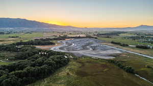 Aerial view at dusk with a rural view and a mountain view