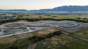 Aerial view at dusk featuring a mountain view