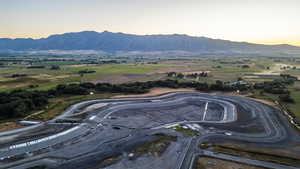 Aerial view at dusk featuring a mountain view