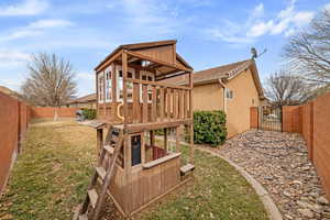 View of play area featuring a lawn