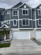 View of front of house with a garage. Color is Subject to change