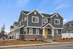 Craftsman house featuring a garage