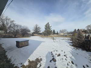 View of yard covered in snow