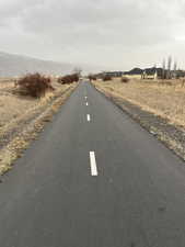 View of street featuring a rural view and a mountain view